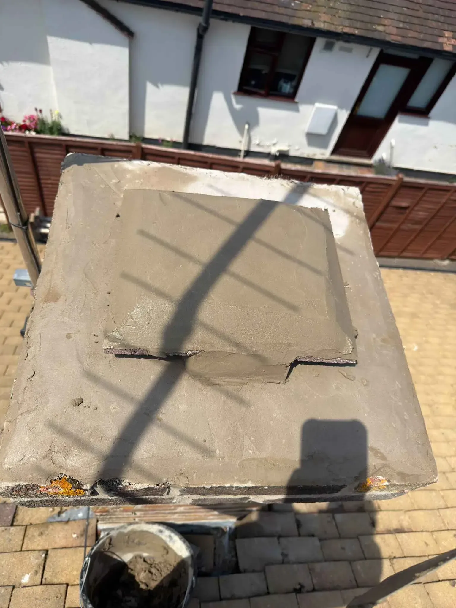 Top of a chimney in Harrow, Greater London, with the pot opening closed over