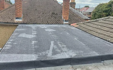 Flat roof area with visible surface seams and edge detailing in Guildford, Surrey