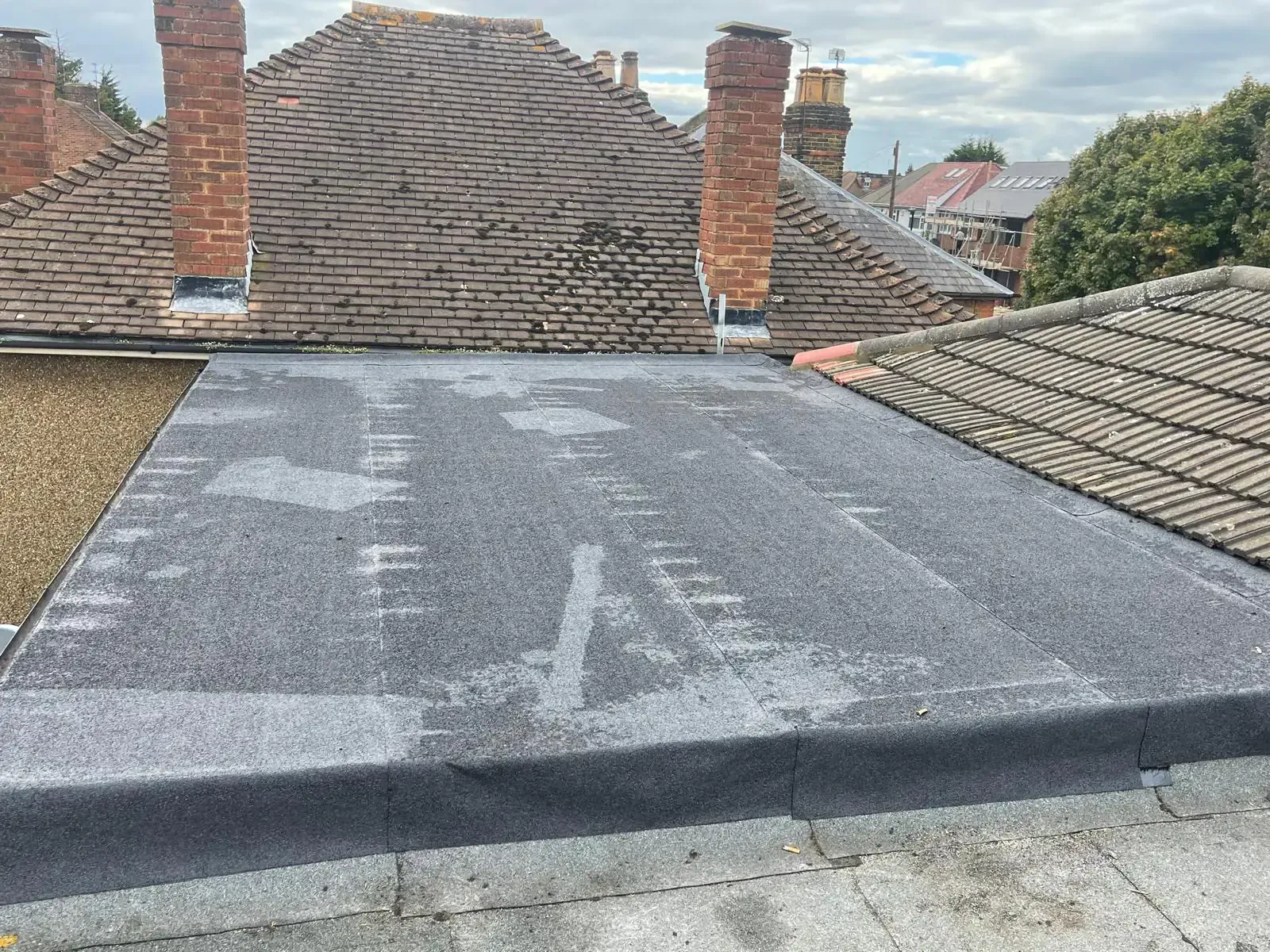 Flat roof area with visible surface seams and edge detailing in Guildford, Surrey