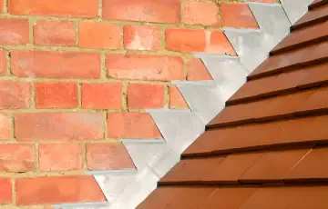 Lead flashing where a brick wall meets a tiled roof